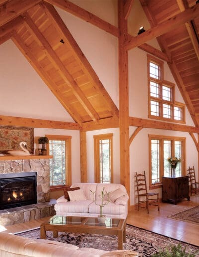 Timber frame interior featuring cathedral ceilings and open floor plan