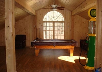 Pool table in front of window in loft