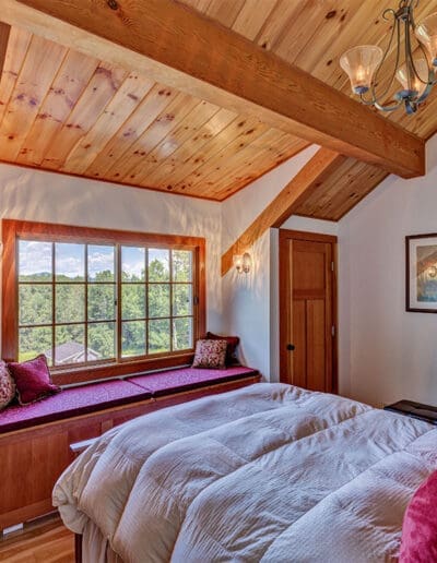 Timber frame bedroom with window seat