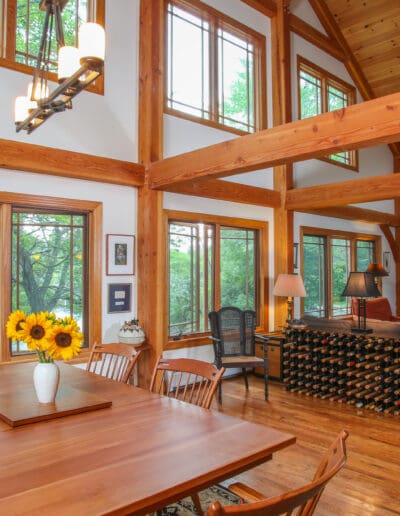 Great Room featuring dining and living area with timber frame cathedral ceilings