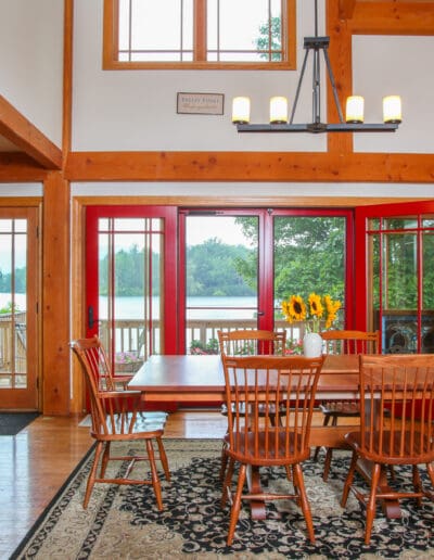 Great Room featuring dining and living area with timber frame cathedral ceilings