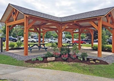 Pavilion with pink flowers and landscaping finished