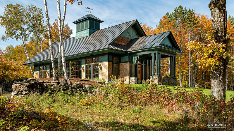 Exterior view of Vermont Natatorium with green trim and cupola