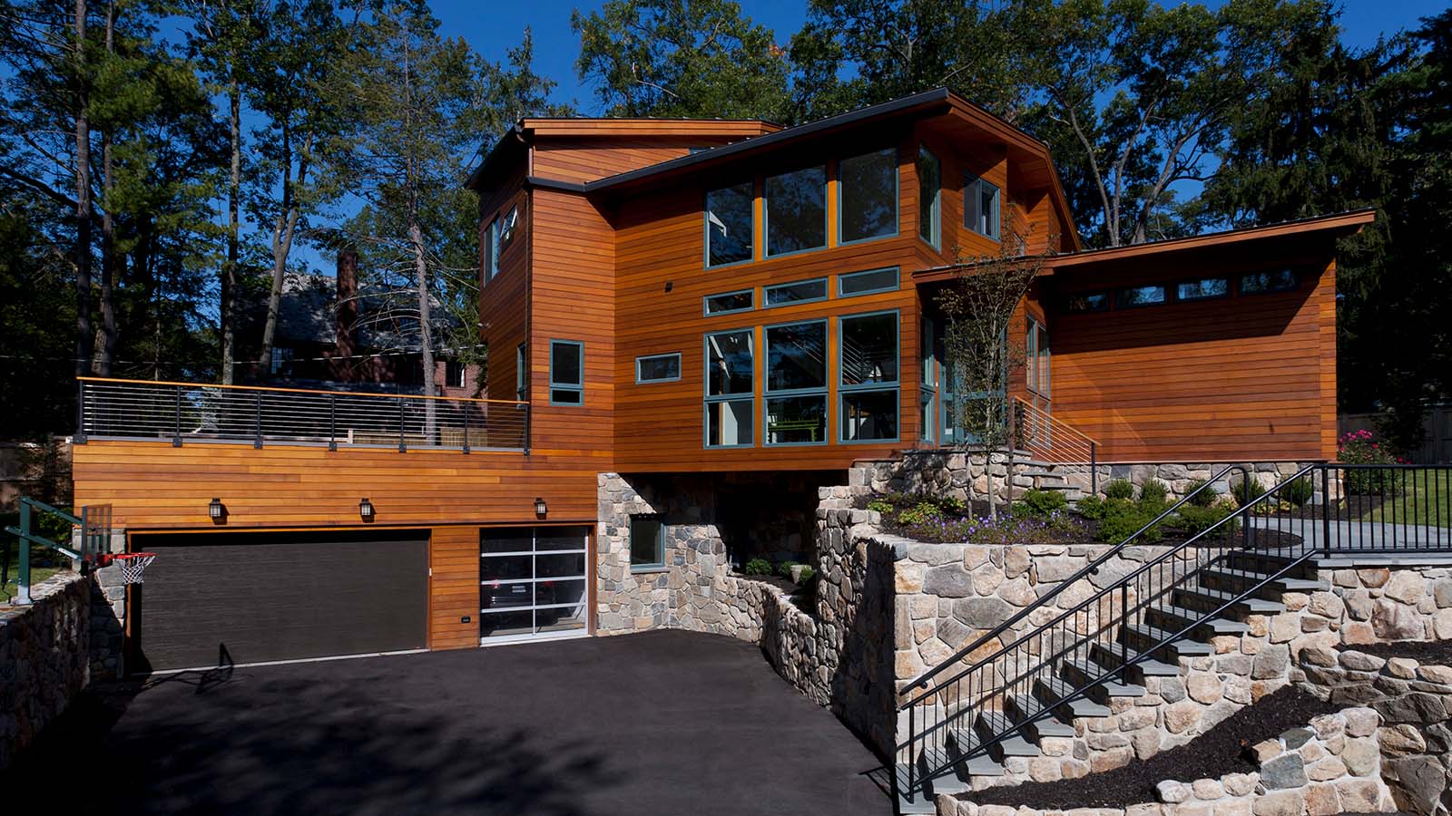 Exterior view of Modern Prefab Home, a panelized home in Massachusetts with beautiful wood siding.