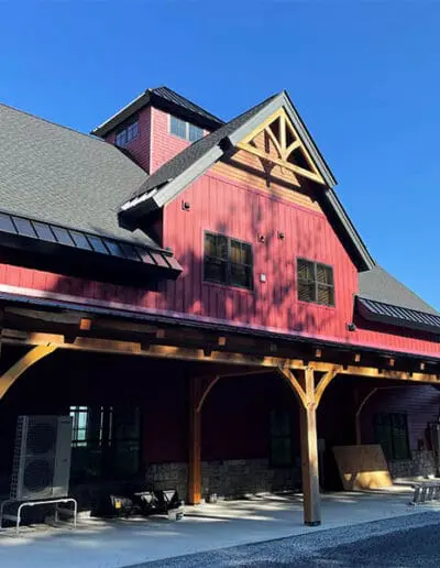 Red barn with cupola and timber frame accents